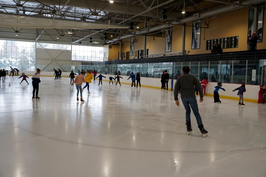 People skating inside of an Ice Rink